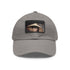 Audrey Hepburn monochrome baseball cap with light brown patch.