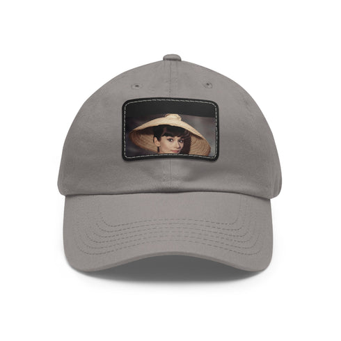 Audrey Hepburn monochrome baseball cap with light brown patch.