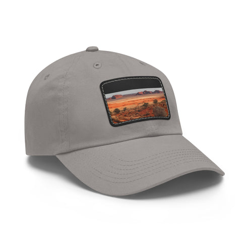 Desert landscape baseball cap with unique rock formations in white.