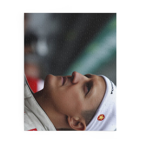 Michael Schumacher jigsaw puzzle with iconic Formula 1 moments.