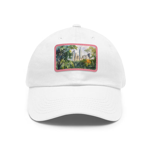 Central Park watercolor skyline baseball cap in white with light brown patch.
