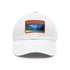 White cotton baseball cap with light brown rectangle patch, island paradise design.