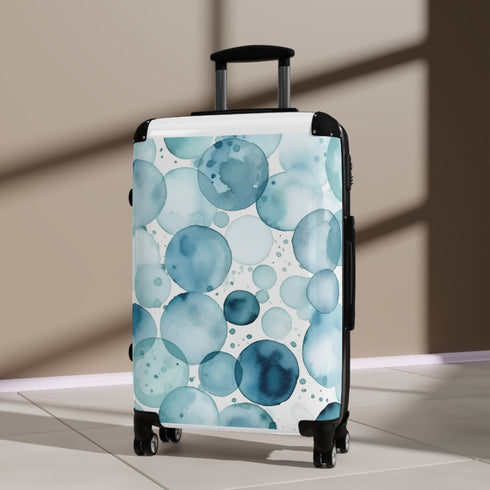 Ocean Blue Eyes Suitcase: Dazzling small black travel bag with eye pattern.