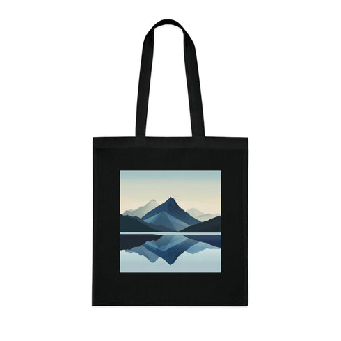 Modern black cotton tote bag with minimalist mountain design.