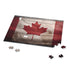 Canadian flag jigsaw puzzle with maple leaf design for patriotic puzzlers.