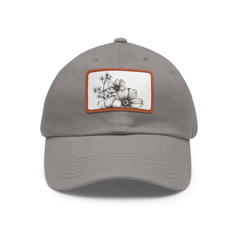 Hand-drawn floral white baseball cap with light brown patch.