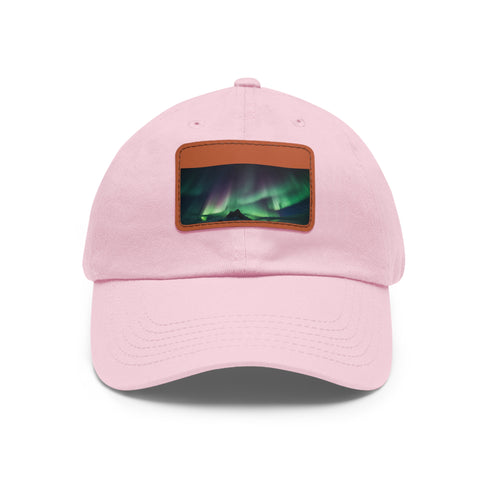 Northern lights themed baseball cap in white with light brown patch.