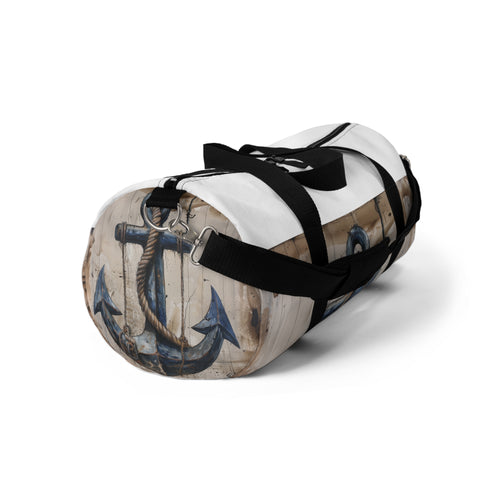 Nautical-themed blue duffle bag with anchor and rope design.