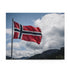 Challenging jigsaw puzzle of Norway flag against stunning Nordic landscape.