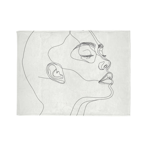 Soft luxury blanket with unique Face Art design, perfect for relaxation.