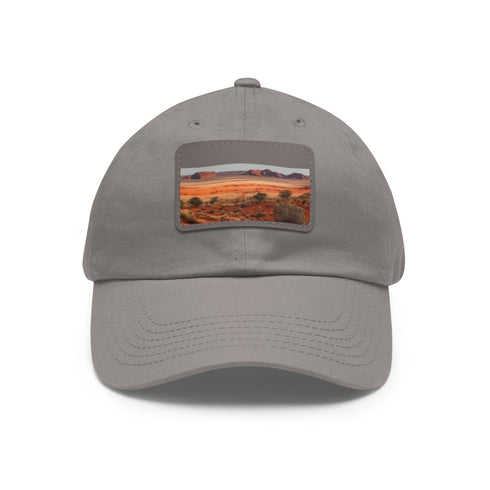 Unisex white cotton hat with desert horizon rock landscape patch.