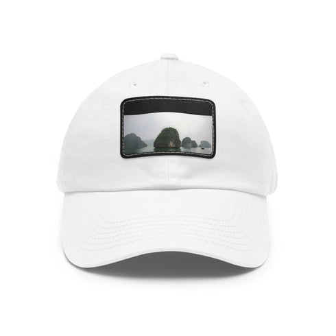 White cotton baseball cap with light brown rectangle patch.