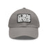 Monochrome baseball cap in white with light brown rectangular patch.