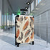 Feathered boho chic black small suitcase with vibrant seamless pattern.