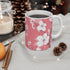 Pink and white cherry blossom ceramic mug for elegant coffee sipping.