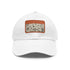 Botanical baseball cap with light brown patch and botanical illustrations.