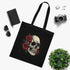Dark floral skull design on black cotton tote bag.