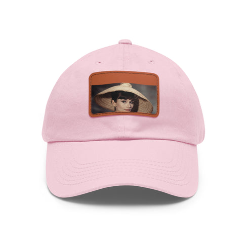 Iconic Audrey Hepburn monochrome baseball cap with light brown patch.
