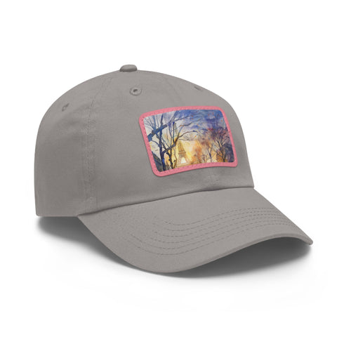Eiffel Tower watercolor baseball cap, white with light brown patch.