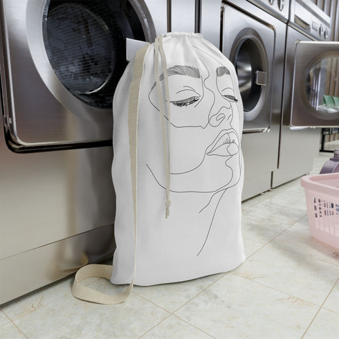 Minimalist abstract face laundry bag for stylish organization in modern home decor