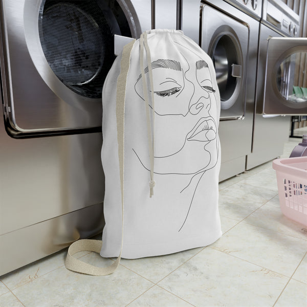 Minimalist abstract face laundry bag for stylish organization in modern home decor