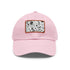 Monochrome baseball cap with repeating pattern design and rectangle patch.