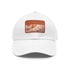 Autumn-inspired foliage patterned cotton hat in white with light brown patch.