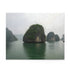 Scenic Halong Bay Vietnam puzzle with emerald waters and limestone formations.