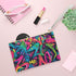Neon graffiti clutch bag, vibrant urban pattern, accessories, vegan, made in USA.