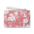 Pink cherry blossom clutch bag with seamless floral pattern.
