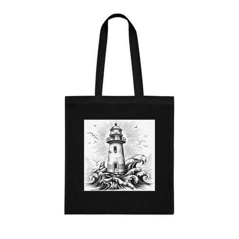 Coastal cotton tote bag with black lighthouse design for adventures.