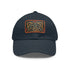 Celtic knot design white baseball cap with light brown patch.