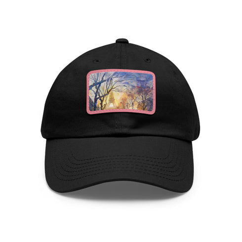 Eiffel Tower watercolor baseball cap in white with light brown patch.