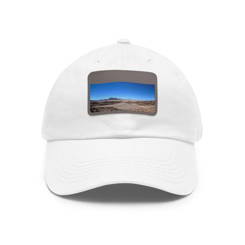 Desert Dreamer baseball cap in white with light brown patch.