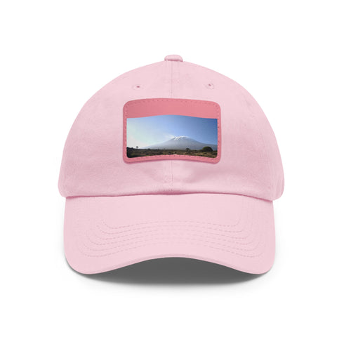 White cotton hat with light brown patch inspired by Kilimanjaro summit.