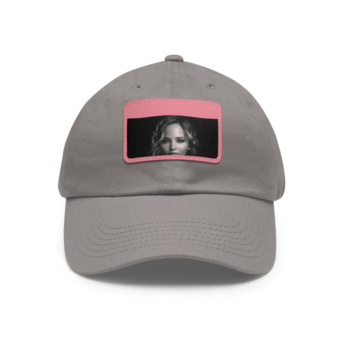 Jennifer Lawrence signature cotton hat with light brown rectangle patch.