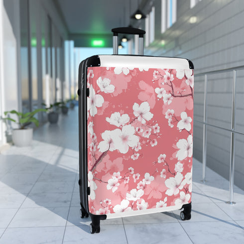 Small black cherry blossom suitcase for stylish travel accessories.