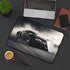 Sleek black Bugatti desk mat features high-speed driving design.