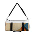 Abstract geometric print small duffel bag with bold colors.
