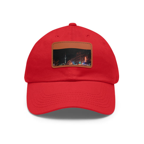 Nighttime Berlin skyline baseball cap in white with light brown patch.