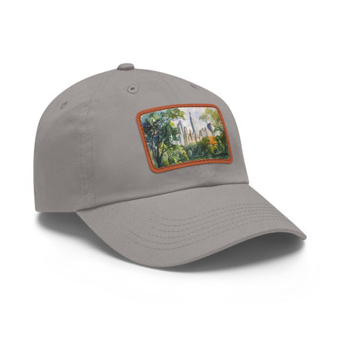 Central Park skyline watercolor baseball cap in white with light brown patch.