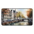 Vibrant Amsterdam cityscape desk mat inspired by historic architecture.