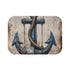 Nautical-inspired bath mat with anchor and rope design for bathroom decor.