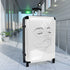 Chic minimalist black small suitcase with face-inspired design for travel.