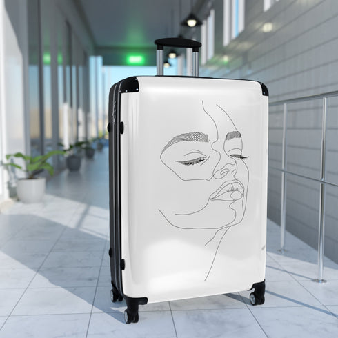 Chic minimalist black small travel suitcase with face-inspired design.