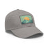 Mountain landscape baseball cap in white with light brown patch.
