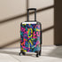 Neon graffiti suitcase with urban pattern for trendy travels.