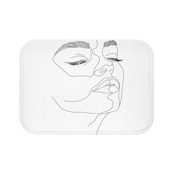 Alt text: Abstract Visage Bath Mat - Minimalist bath mat featuring a line art representation of a human face, adding artistic expression and contemporary style to your bathroom. Size: 24 x 17. High-quality, comfortable, and perfect for all seasons. Makes a great gift. Shop more at BenCPrints.