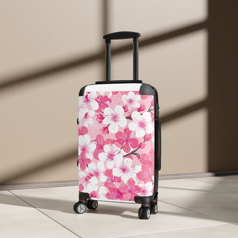 Cherry blossom patterned small black travel suitcase: stylish spring accessory.