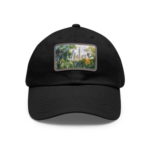 Central Park skyline watercolor baseball cap, white with light brown patch.